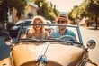 Happy young couple driving a convertible car on a city street. Summer vacation and travel concept