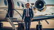 Smiling businessman with private plane on background. Business jet exterior.