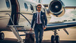 © PaulShlykov - Smiling businessman with private plane on background. Business jet exterior.