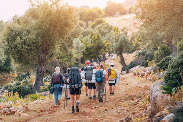 Group of hikers walking by the Lycian Way footpath in turkish countryside