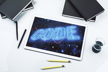 Wall Mural - Creative Code word sign on modern digital tablet display, international software development concept. Top view. 3D Rendering