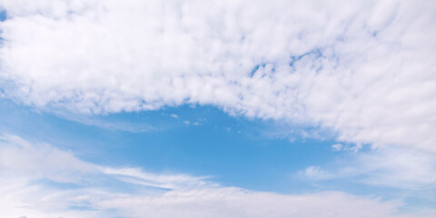 Wall Mural - blue sky with white altocumulus clouds on a daytime. panorama