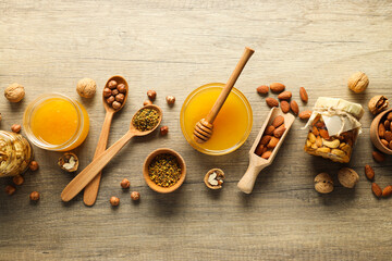 Concept of tasty and sweet food - honey with nuts