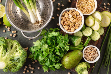 Wall Mural - Clean eating background, fresh green vegetables with beans top view, balanced vegetarian food