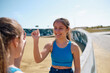 © Westend61 - Happy girls playing together in skateboard park