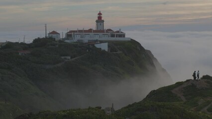Wall Mural - beautiful dark evening panorama with farol lighthouse in the atlantic ocean at cape cabo da roca, po