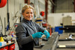 © Johnér - Young female industrial worker working in factory