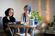 © Johnér - Mother wearing hijab helping son with ADD or ADHD doing homework
