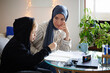 © Johnér - Mother wearing hijab helping son with ADD or ADHD doing homework