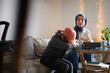 © Johnér - Mother wearing hijab helping tired son with ADD or ADHD doing homework