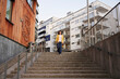 © Johnér - Low angle view of woman walking down stairs