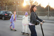 © Johnér - Young women and boy skateboarding together