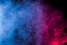 Abstract Texture Smoke In Red Blue On A Black Background.