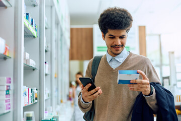 Poster - Young Muslim man buying medicine in pharmacy.