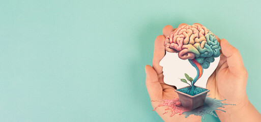 hands holding paper head, human brain grows from tree, self care and mental health concept, positive