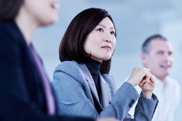 Wall Mural - Attentive serious businesswoman listening in meeting