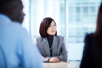 Wall Mural - Businesswoman listening in meeting