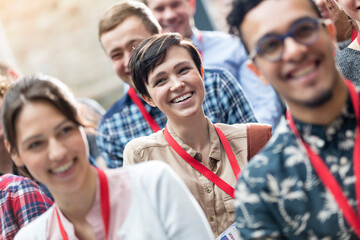 smiling audience enjoying conference