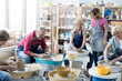 © KOTO - Mature students using pottery wheels in studio
