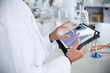 Scientist using digital tablet in laboratory