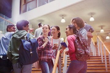 College students talking in stairway