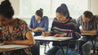 © KOTO - College students taking test at desk in classroom
