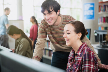 College students using computer in computer lab classroom