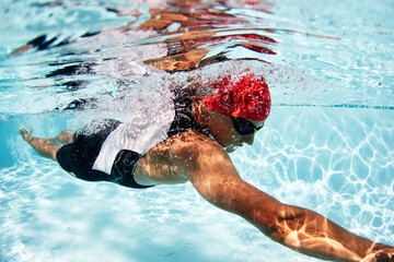 Canvas Print - Male swimmer athlete swimming underwater in swimming pool