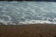 Sea waves on a sand beach