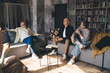 © BullRun - Group of elderly friends gathering in living room communicating