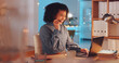 © Azee/peopleimages.com - Call center, night and computer of woman, agent or consultant global discussion, tech support or online service. Friendly biracial person or business telecom worker in virtual conversation on laptop