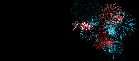 Wall Mural - red and blue fireworks on black background