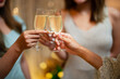 © mojo_cp - Group of friends celebrating with champagne  Close up on hands.