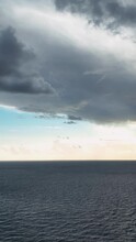 Vertical Video: Skyline Serenade - Aerial View Of The Breathtaking Coastal Cloudscape At Sunset