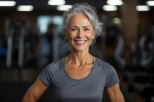 Portrait Of Smiling Senior Woman Exercising In Fitness Studio At The Gym