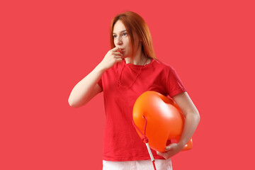 Wall Mural - Female lifeguard with rescue buoy whistling on red background