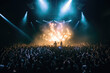 © Michael Schauer - crowd of people watching and dancing to a metal show with fire stageshow