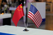 Flags of the China and USA together at some event or fair. The flags of the two countries as a symbol of cooperation between the two states. Joint business of the United States of America and China