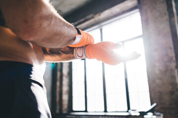 Wall Mural - Man stretching arms in gym