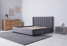 Comfortable Bed With Storage Space For Bedding Under Slatted Base In Stylish Room