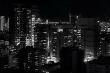 Contemporary Cityscape At Night, Rendered In Monochrome With Obscured Figure And Simplistic Style. Generative AI