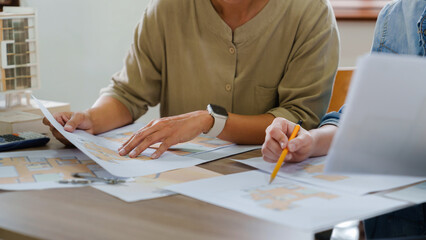 Leinwandbilder - Architects interior designer hands working with Blue prints and documents for a home renovation for house design