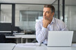 © insta_photos - Busy serious mature business man ceo executive investor of mid age looking away using laptop computer thinking over financial strategy investing risks working in office. Copy space