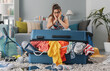 © StockPhotoPro - Stressed woman packing for a vacation