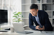 © kamiphotos - Man in the office, he is young businessman, modern business management, start-up company run by young people, modern entrepreneur with new ideas. to be a business leader. Startup company concept.