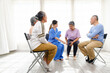 © artitwpd - The caregiver therapist sits with a group of Asian senior people in a circle for checking physical and mental health in a group elderly therapy session. The nursing home facilitates a support group