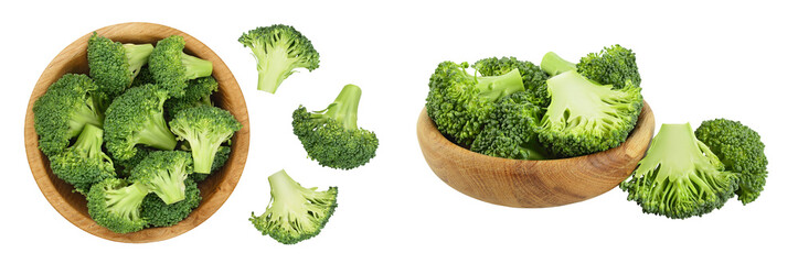 Wall Mural - fresh broccoli in wooden bowl isolated on white background close-up with full depth of field. Top view. Flat lay