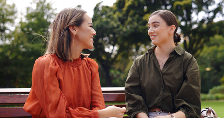 Wall Mural - Friends, women and laughing at park on bench, bonding and talking together. Girls, outdoor and happiness of people in conversation, comic discussion or comedy and enjoying quality time for friendship