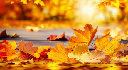 Poster - Beautiful orange leaves on a wooden table in the autumn park. Natural autumn background with blur.