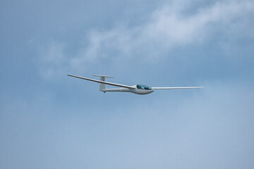 Wall Mural - Glider plane flying in the clouds